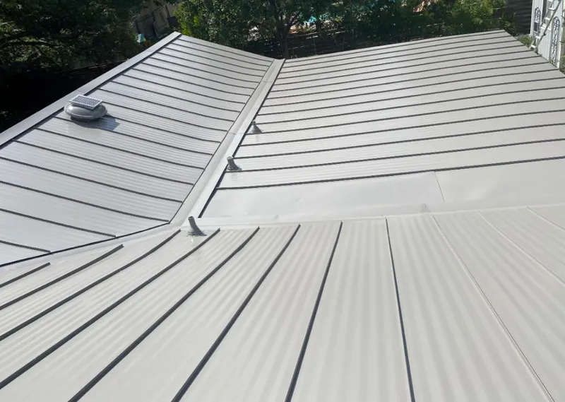 Solar attic fan installed on a metal roof for Roof Ventilation in Three Rivers